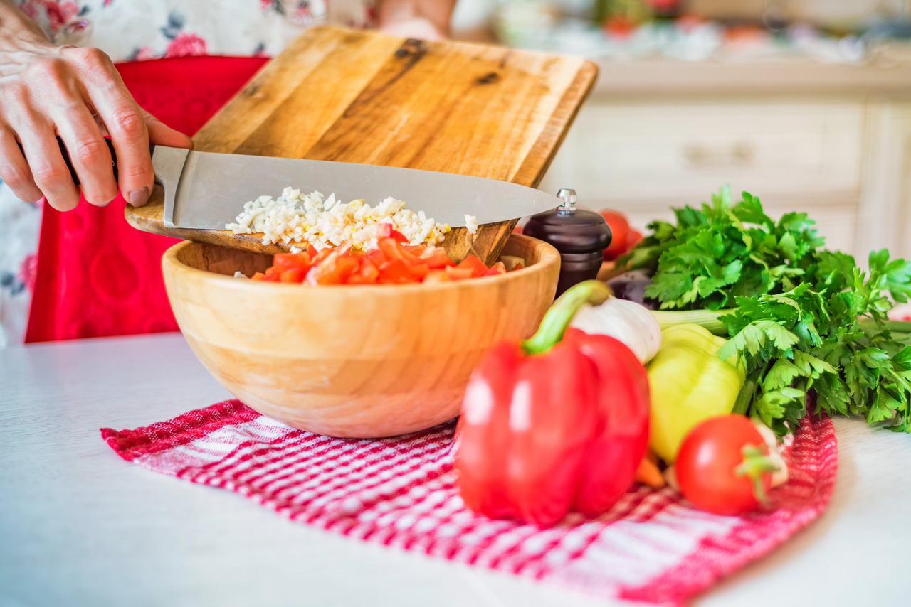 female-hand-put-chopped-garlic-in-wooden-bowl-with-2024-10-18-07-33-45-utc (1)